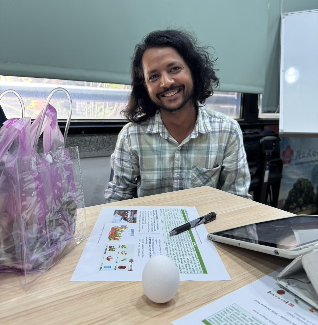  A Scholar smiles proudly with his successfully balanced eggs.